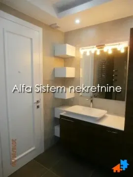 Modern bathroom with a washbasin, mirror and white door. - image 14