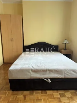 Furnished bedroom with a double bed, wardrobe, and nightstand. - image 16