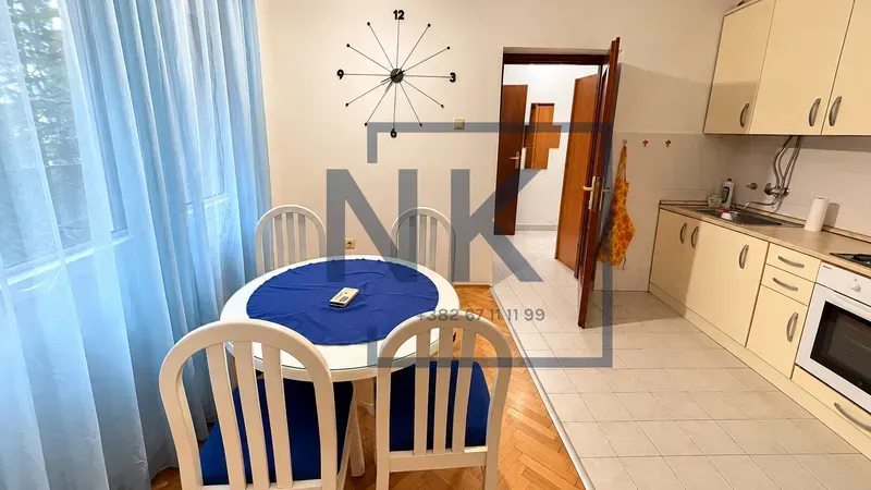 Kitchen with a dining area and a table with chairs.