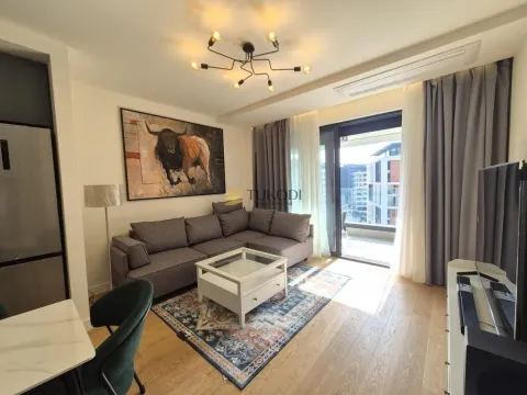 Living room with a sofa, coffee table, and access to the terrace. - image 3