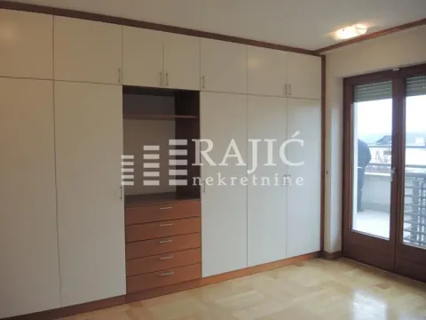 Bedroom with a large built-in wardrobe and access to the terrace. - image 3