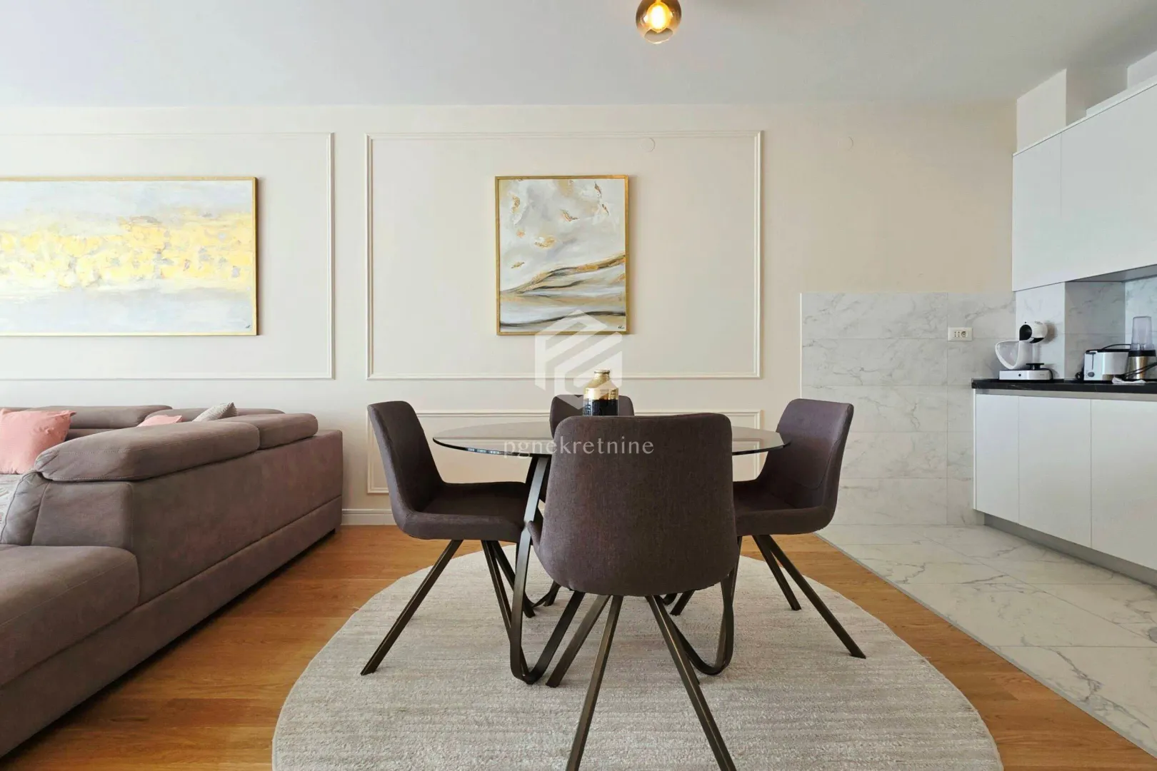 Living room with dining area and modern furniture.
