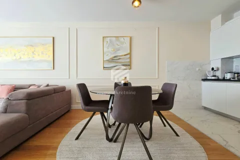 Living room with dining area and modern furniture. - image 7