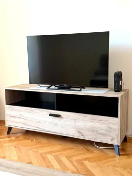 TV cabinet with television in the living room. - image 3