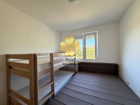 Children's bedroom with a bunk bed and a double bed. - image 7