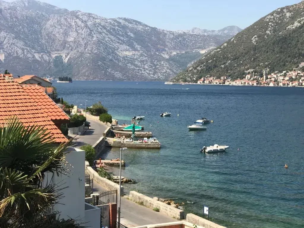 View from the terrace towards the sea, coast, and mountains in the bay.