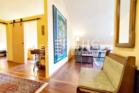 Living room with a sofa and a hallway access. - image 11