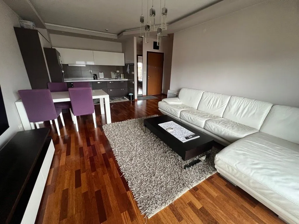 Spacious living room connected to the dining area and kitchen.