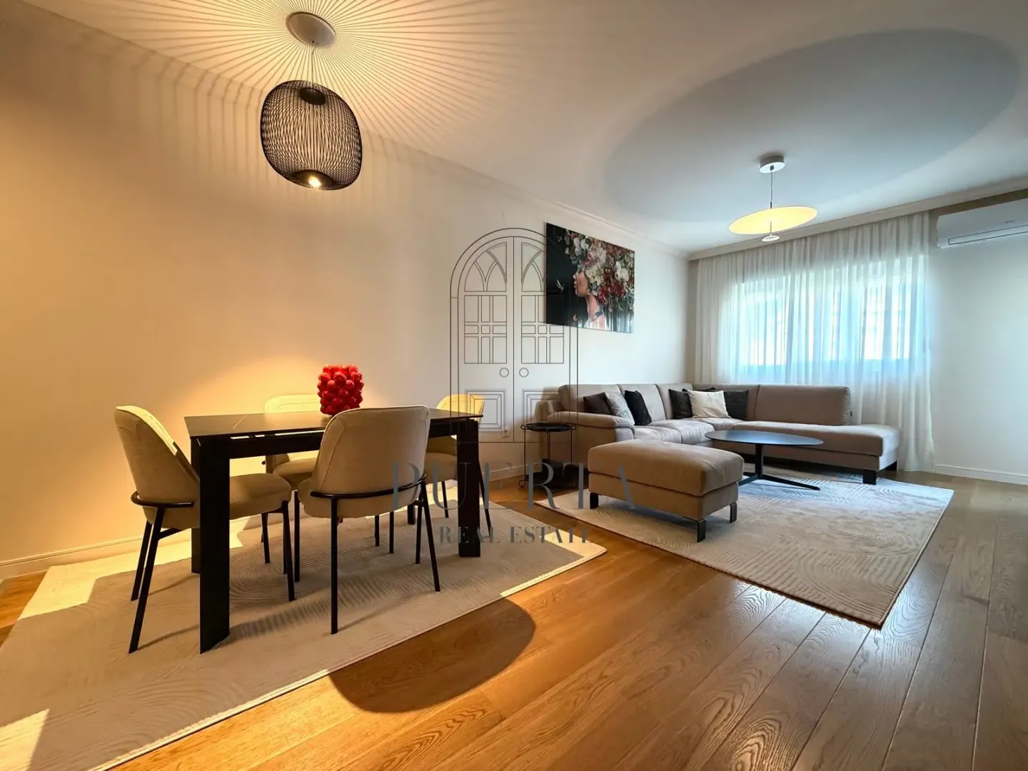 Living room with dining area and seating set.