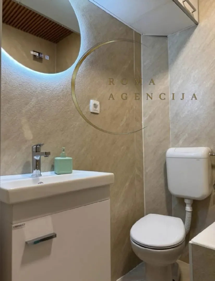Small bathroom with a sink and toilet.