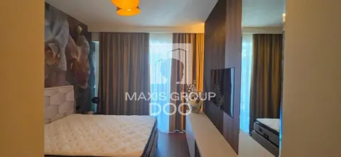 Modern bedroom with a double bed, TV, and curtains. - image 9