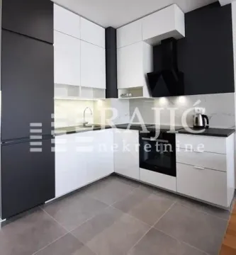Modern kitchen with white and black elements. - image 5