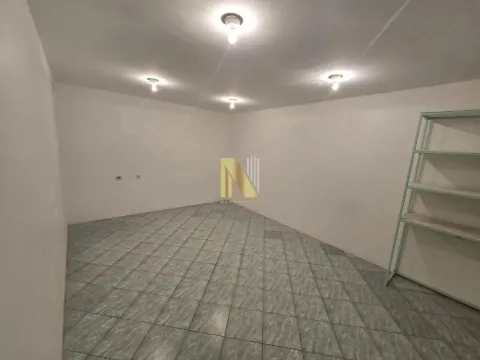 Empty room with floor tiles and a shelving unit. - image 5