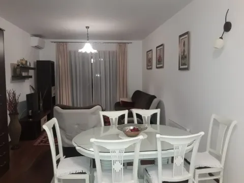 Bright living room with a dining table and seating area. - image 7
