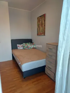 Furnished bedroom with a double bed, dresser, and a painting on the wall. - image 8