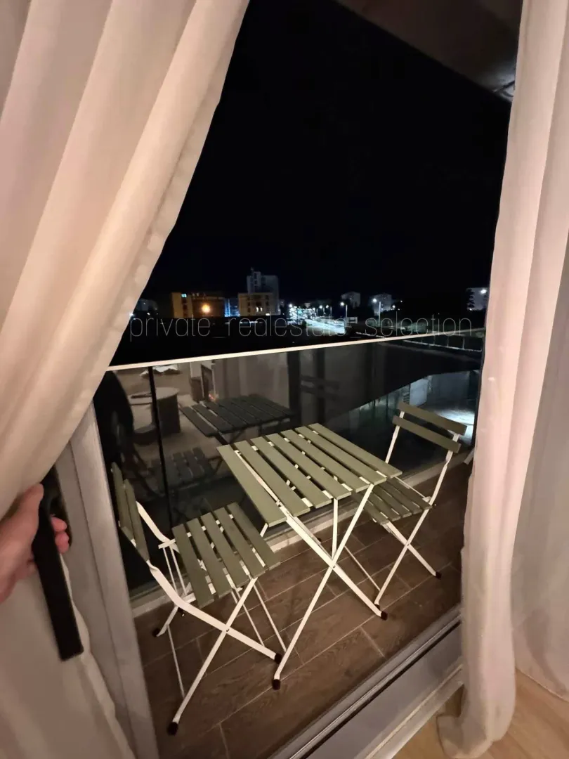 Small terrace with outdoor seating set.