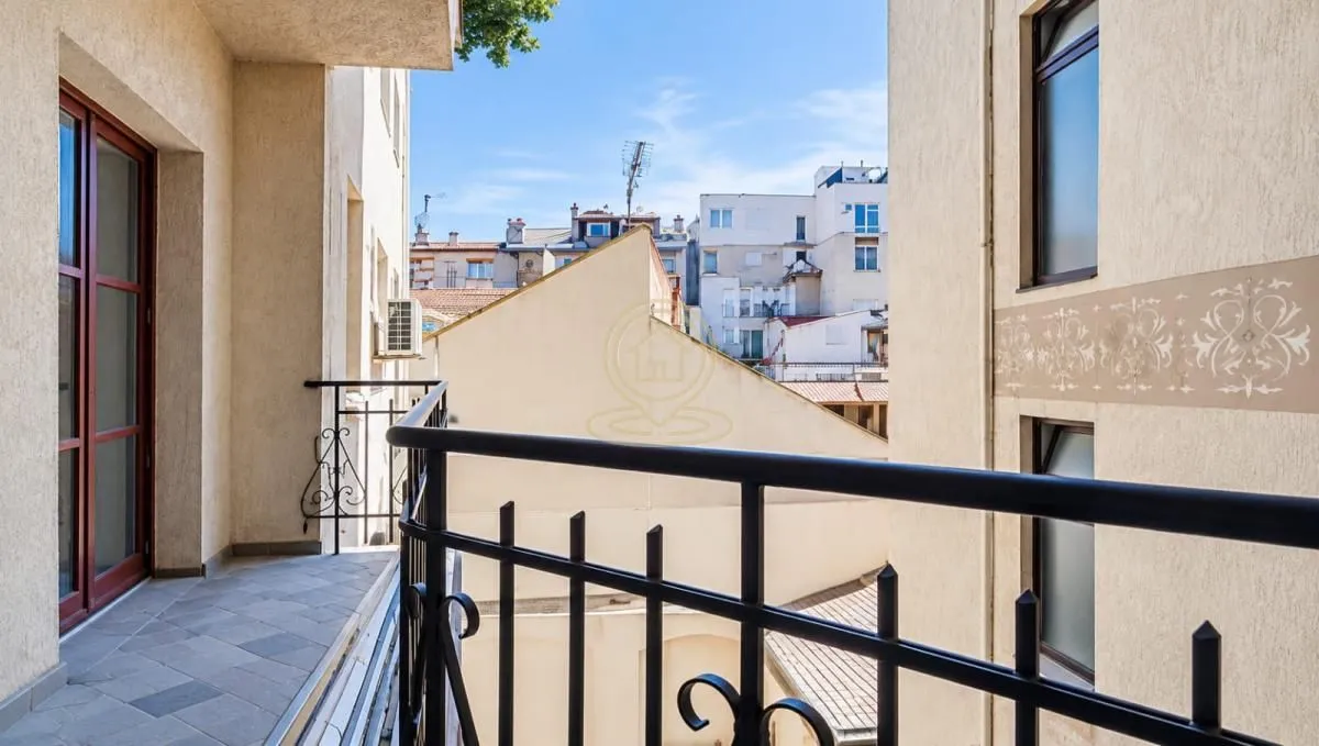 View from the balcony overlooking surrounding buildings and the city center.