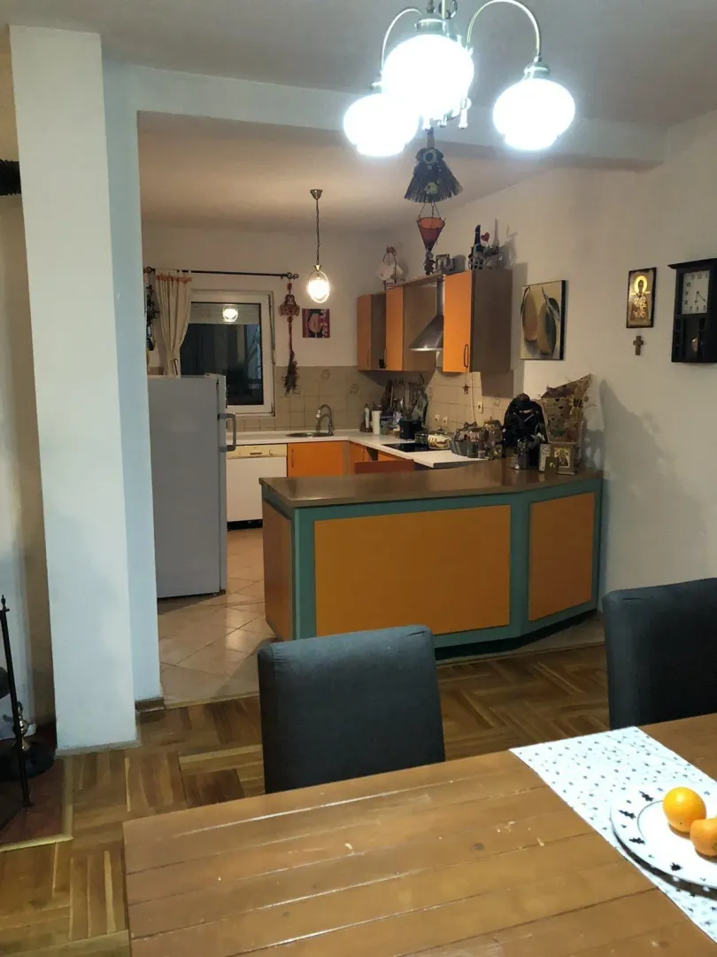 An open kitchen with a bar counter facing the dining area.