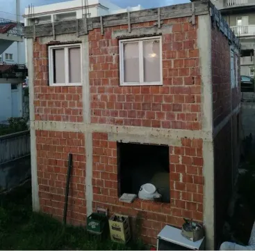 An unfinished brick house under construction. - image 7