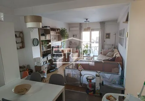 Living room with sofa set and dining table in the foreground. - image 13