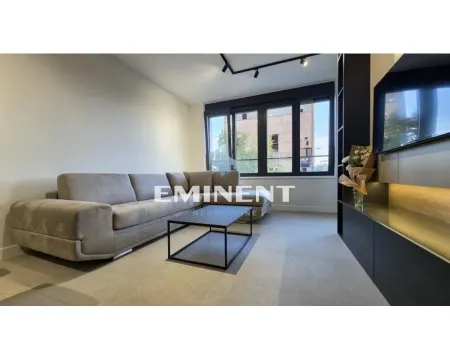 Living room with a sectional sofa, coffee table and TV. - image 3