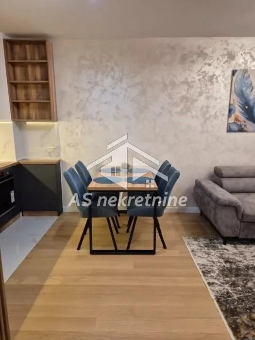 Living room with a dining table and chairs.