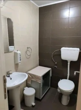 Smaller bathroom with a sink and toilet bowl. - image 5