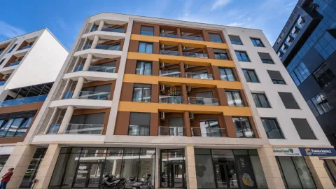 Spoljašnji izgled moderne stambene zgrade sa terasama i poslovnim prostorom u prizemlju. - image 13