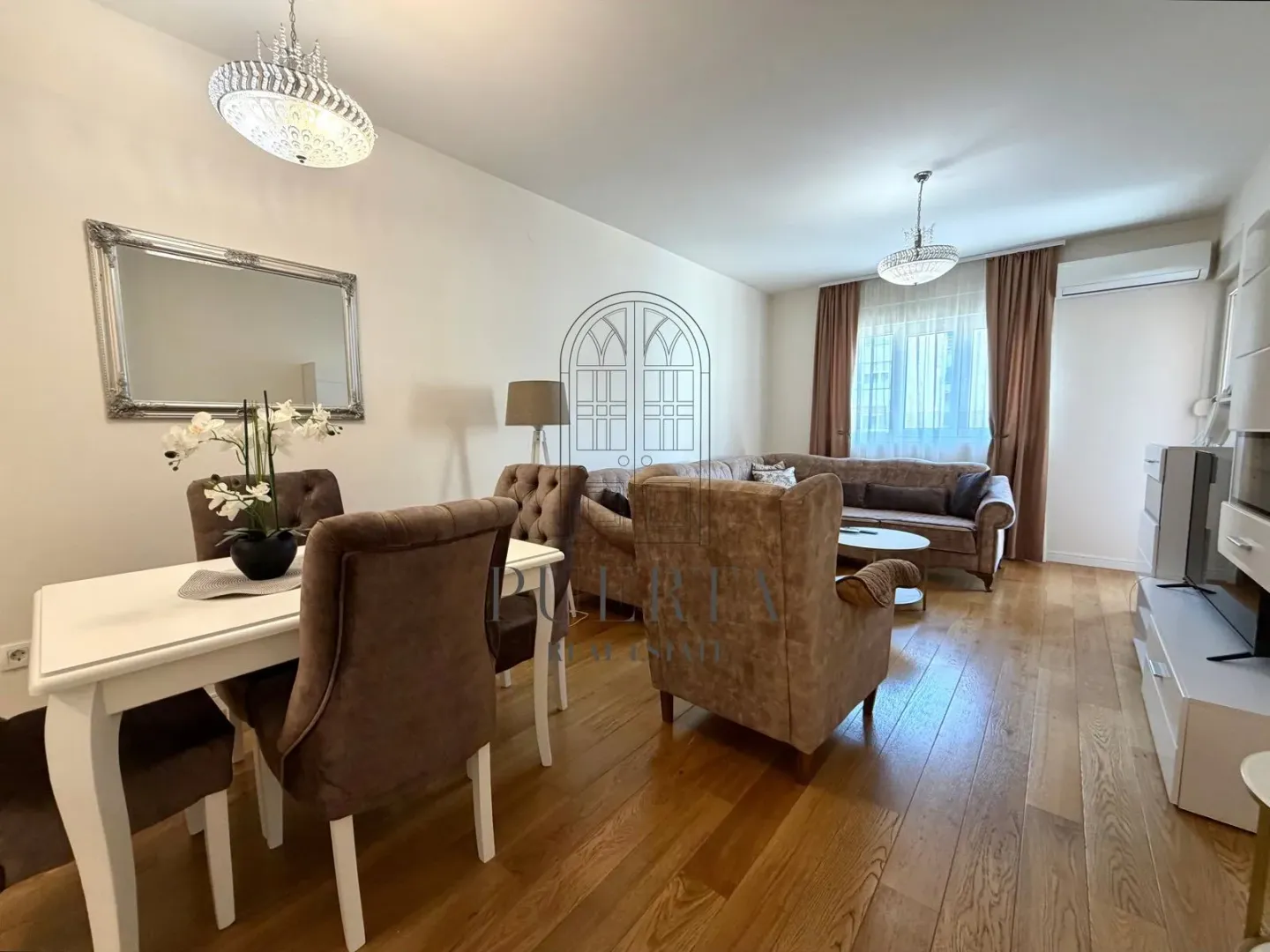 Spacious living room with a dining area and seating set.