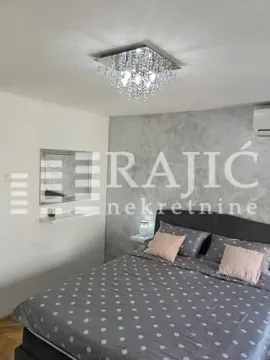 Furnished bedroom with a double bed. - image 11