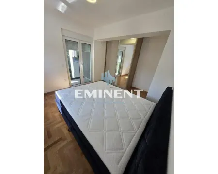 Bedroom with a double bed, wardrobe, and terrace access. - image 8