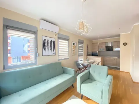 Living room connected to the dining area and kitchen. - image 2