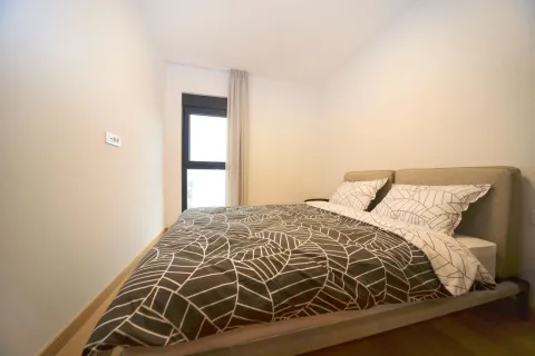 Bedroom with a double bed and a window. - image 7
