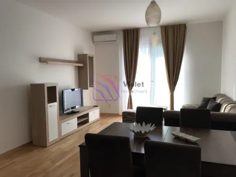 Living room with dining area, sofa set, and television. - image 3
