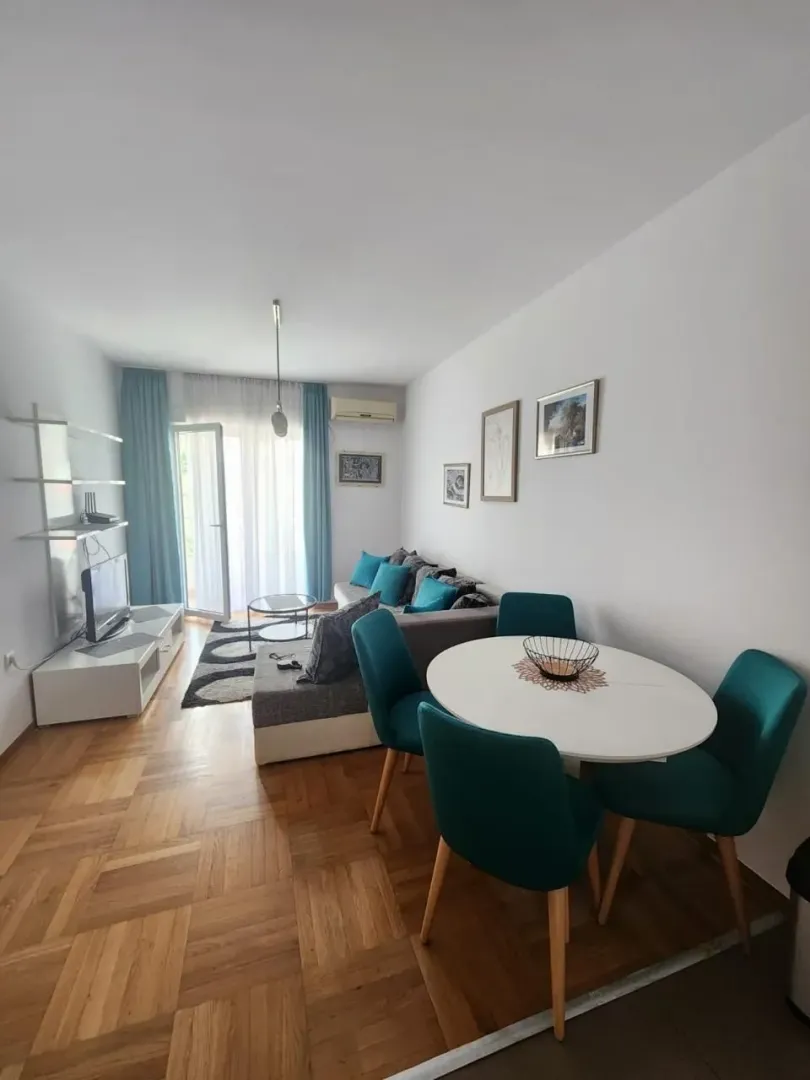Living room with dining area and terrace access.