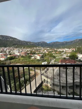 View from the terrace overlooking the settlement and mountains in the background. - image 7