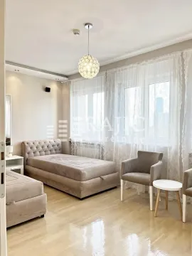 Furnished bedroom with a bed and armchairs. - image 19