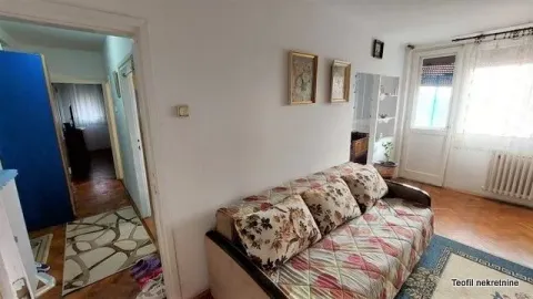 Living room with a sofa and view of the hallway. - image 2