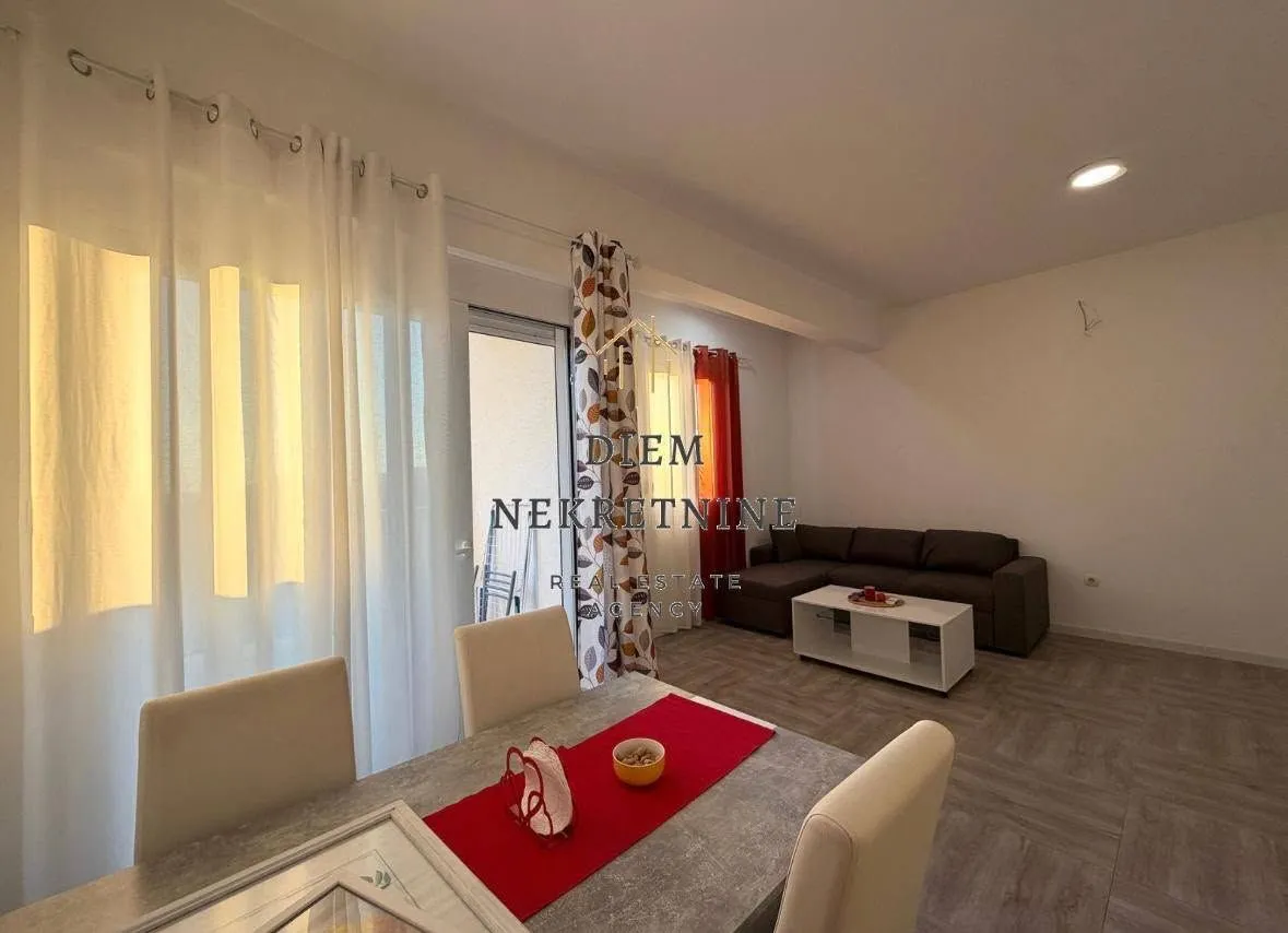 Living room with a dining area.