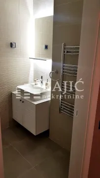 Modern bathroom with sink and shower cabin. - image 10