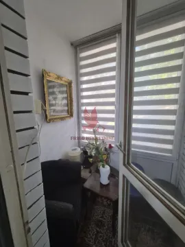 Enclosed terrace with seating furniture and window blinds. - image 11