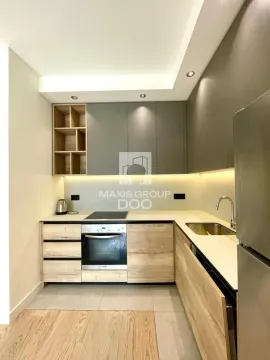 Modern kitchen with built-in oven, hob and sink. - image 3