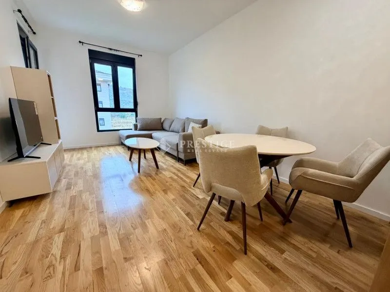 Living room with dining area and sofa.