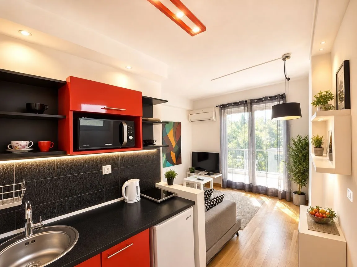 Small kitchen connected to the living room in an open-plan living space.