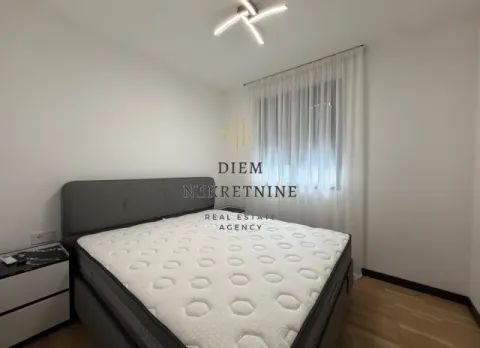 Modern bedroom with a double bed and white curtains. - image 10