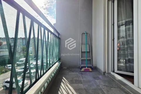 Small balcony with metal railing and street view. - image 12