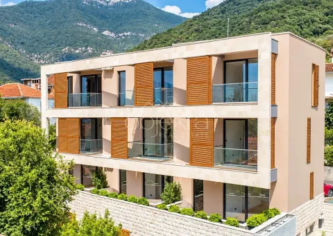 Exterior view of a modern residential building with balconies and wooden shutters. - image 10