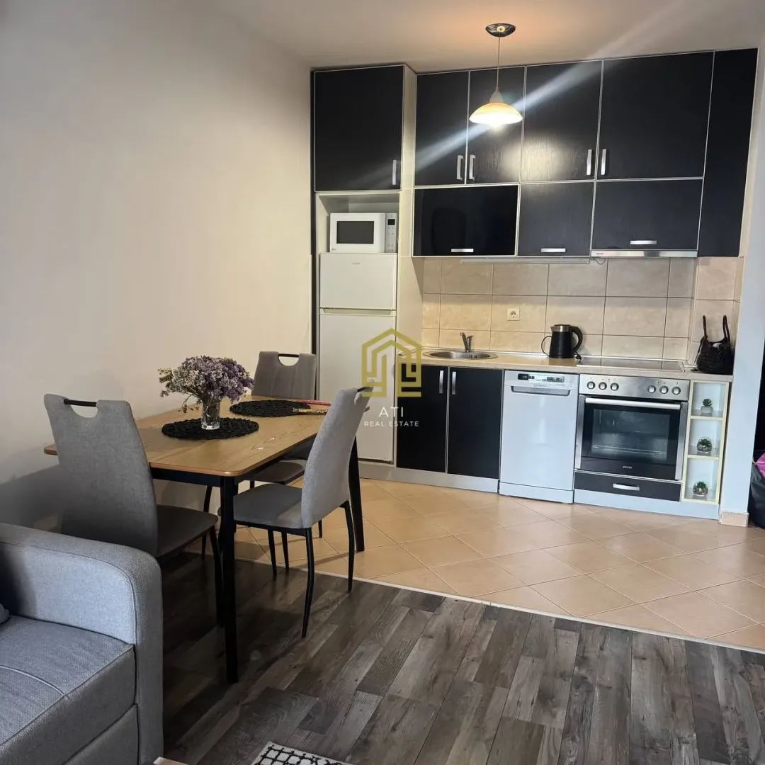 Kitchen with a dining area and modern fixtures.