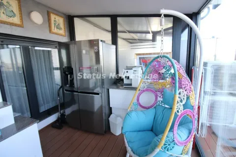 Enclosed terrace with a refrigerator and a hanging chair. - image 19
