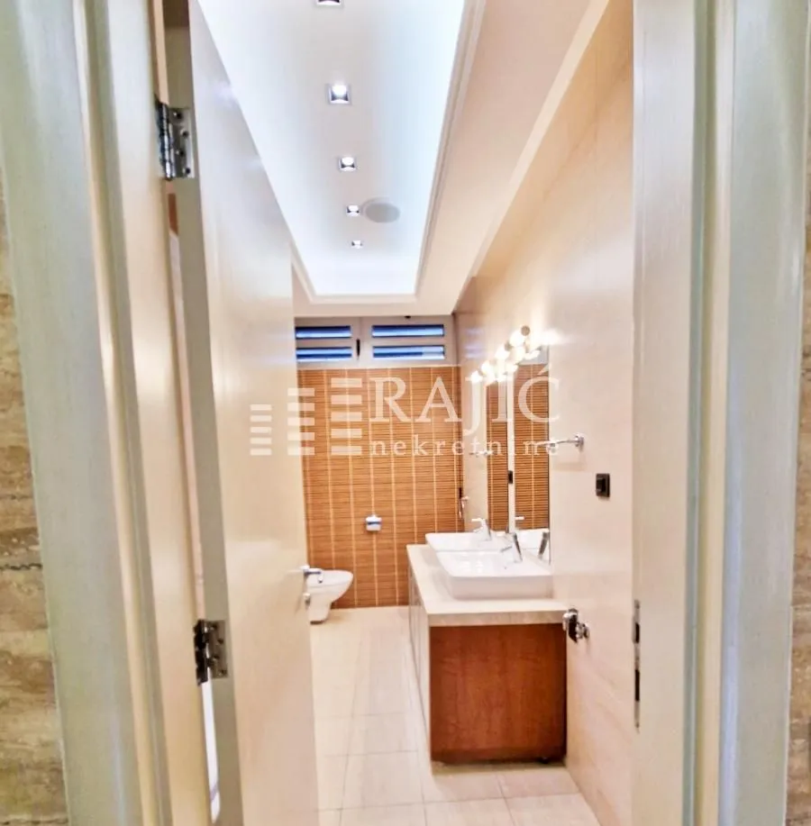 View of a modern bathroom with double sinks.